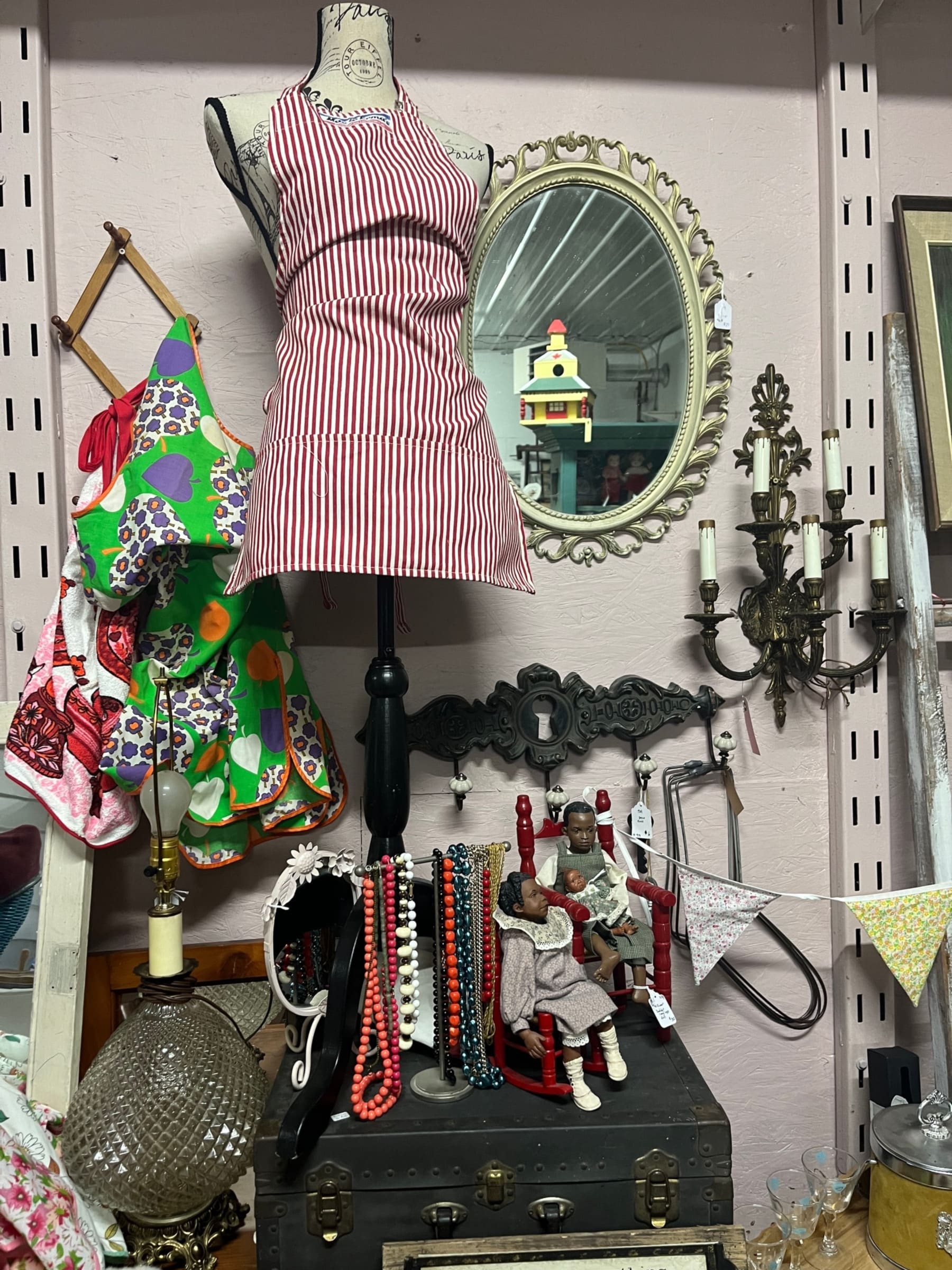 Vintage mirrors, sconces and jewellery at a consignor booth
