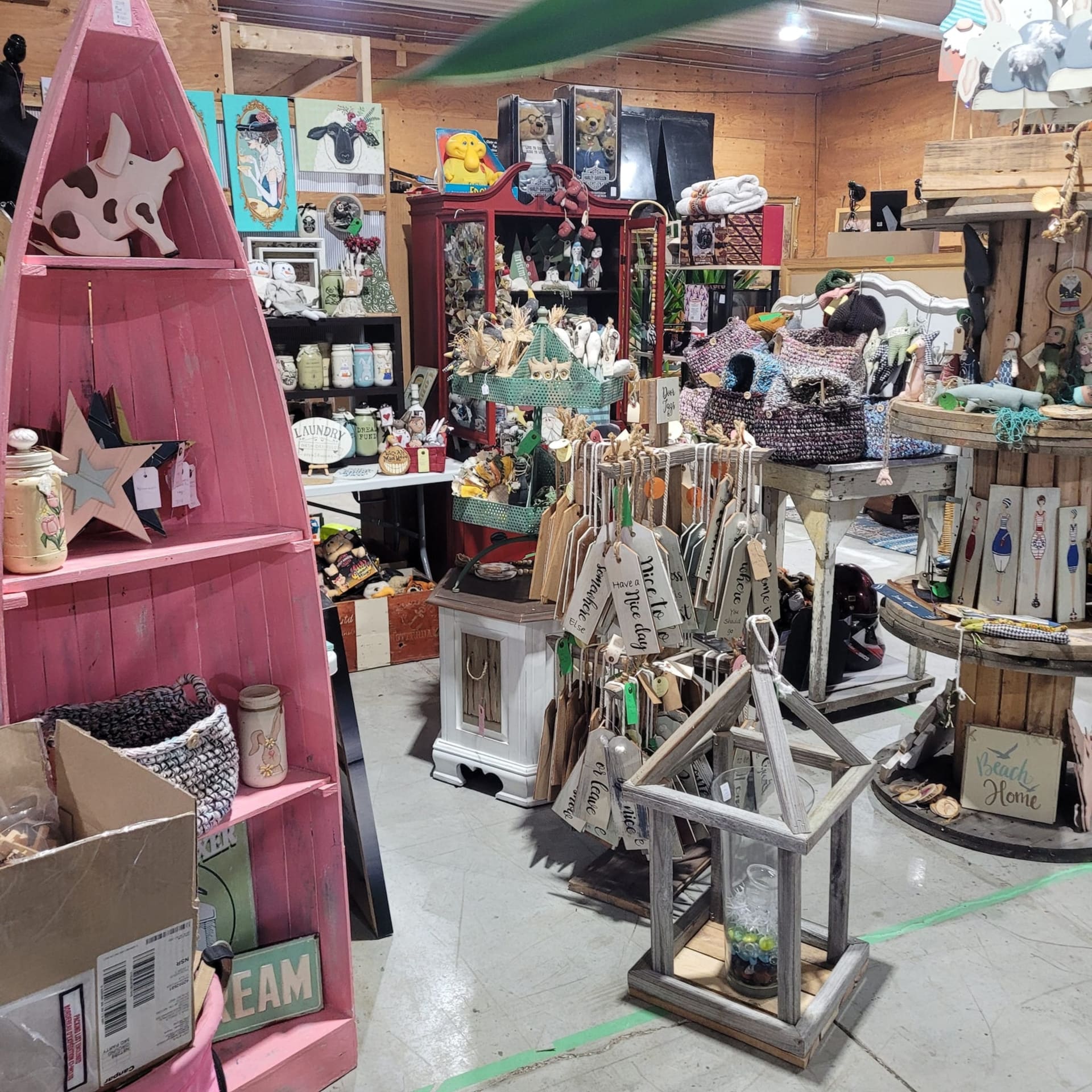 A consignor booth of handcrafted home decor in the OSA Auctions market